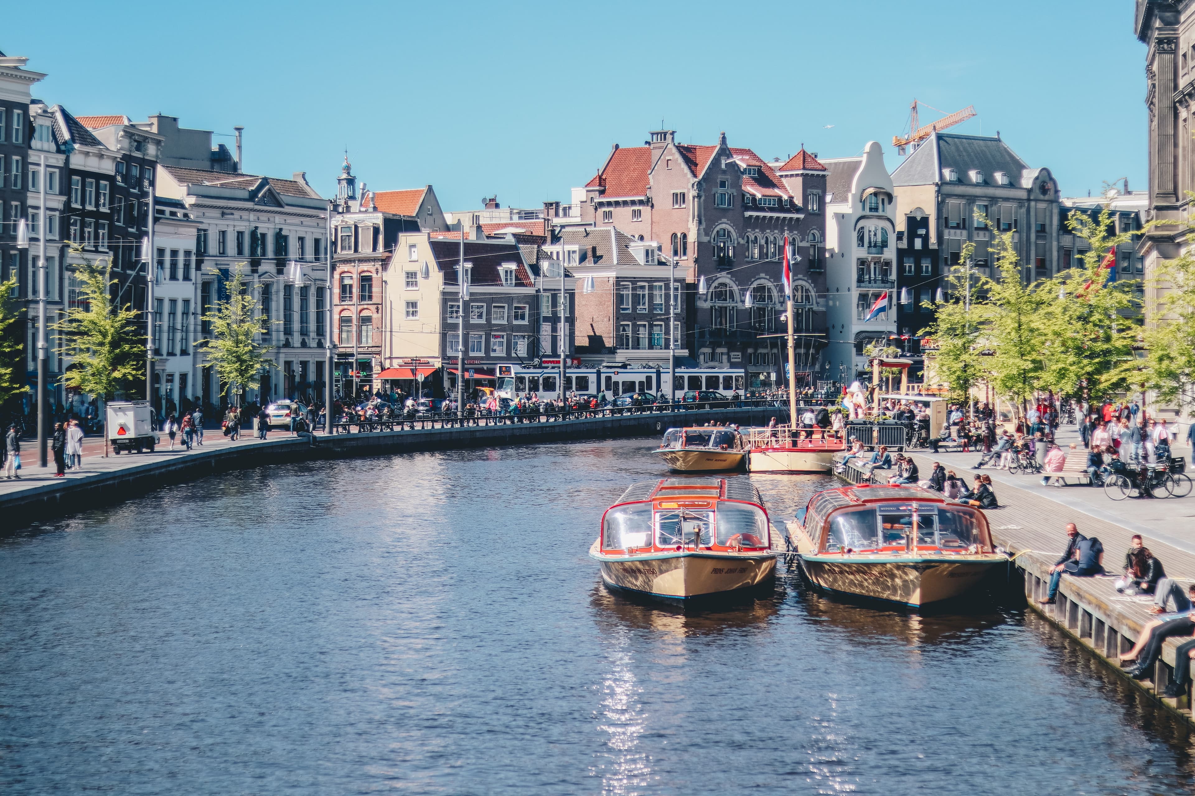 Boats docked in the canal in Amsterdam, Netherlands